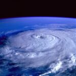 A breathtaking satellite image capturing a swirling hurricane over the Earth's ocean.