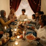 A happy family gathering around a candlelit table for a festive dinner with diverse members.