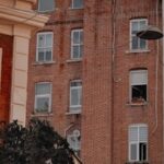 Charming brick facade of a residential building in Istanbul's urban landscape.