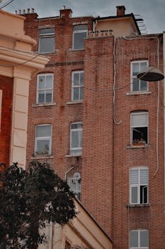 Charming brick facade of a residential building in Istanbul's urban landscape.